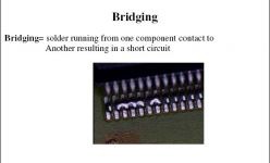 Bridging = solder running from one component contact to another resulting in a short circuit 